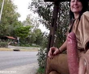 fellow with a big pecker is squirting on the miss outdoor