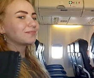 young slut with blond hair is pleasuring a guy with a hand in public