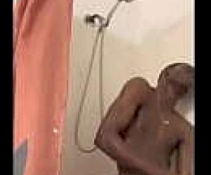 guy  is pleasured with her mouth in the shower