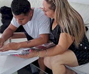 guy with an impressive cock is pleasured with her mouth at home