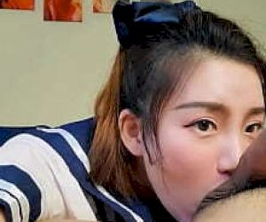 Asian  does it with her lips