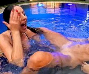 well endowed Lesbian with a shaved pussy has sex at the pool