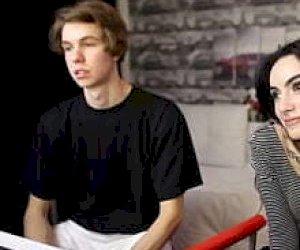 young girl with a thin silhouette is covered with sperm in front of the webcam