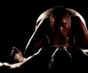 hairy black girl with a shaved pussy is playing with her pussy